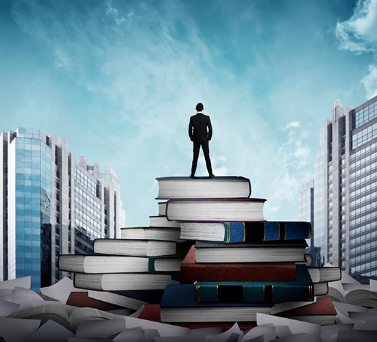 A man standing on a pile of books and documents